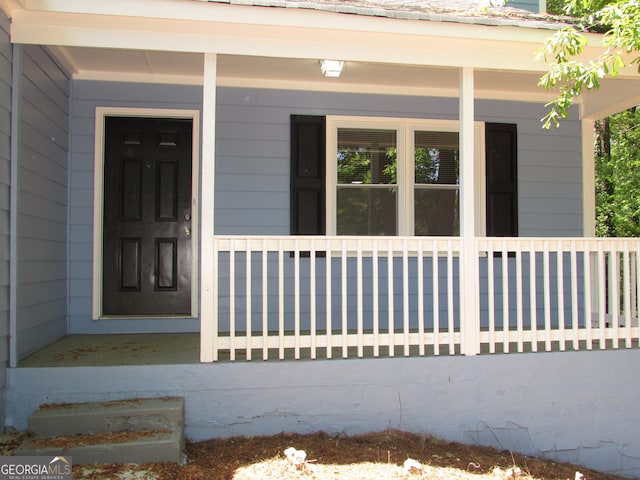 entrance to property with covered porch