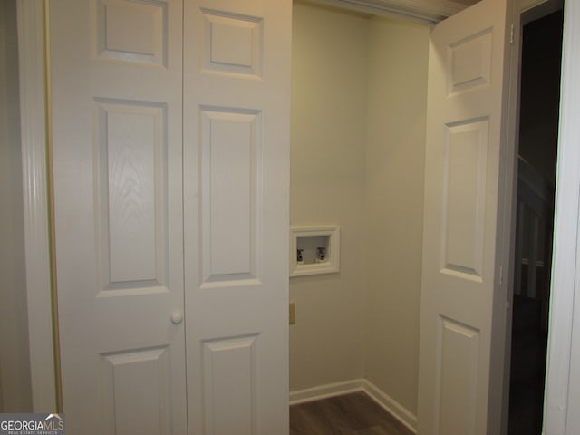 laundry area with hookup for a washing machine and dark wood-type flooring