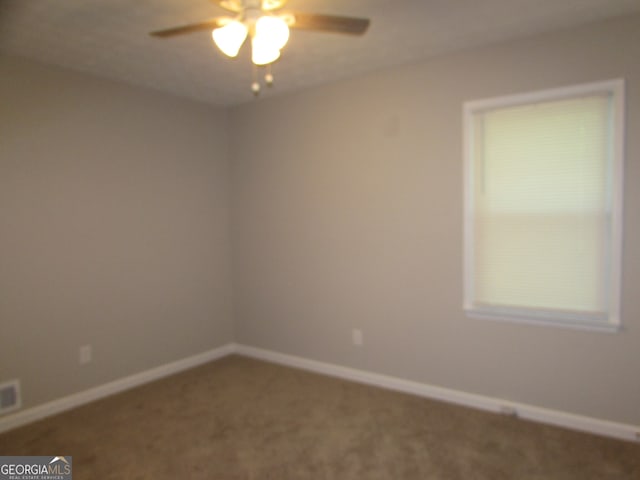 empty room with carpet and ceiling fan