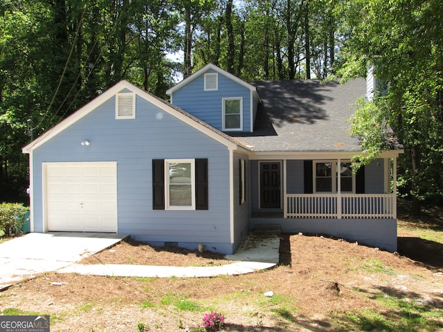 view of front of home with covered porch and a garage