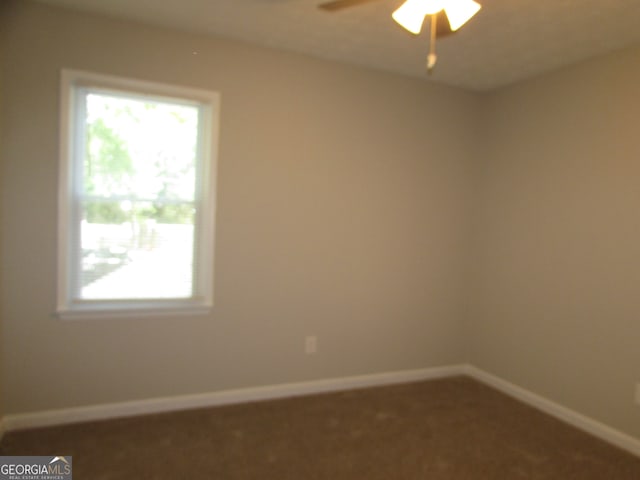 carpeted empty room with ceiling fan