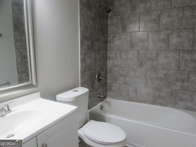 full bathroom featuring vanity, toilet, and tiled shower / bath combo