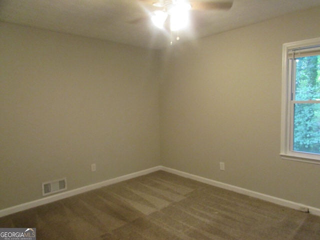 empty room with carpet and ceiling fan