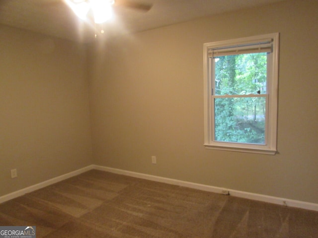 carpeted empty room with ceiling fan