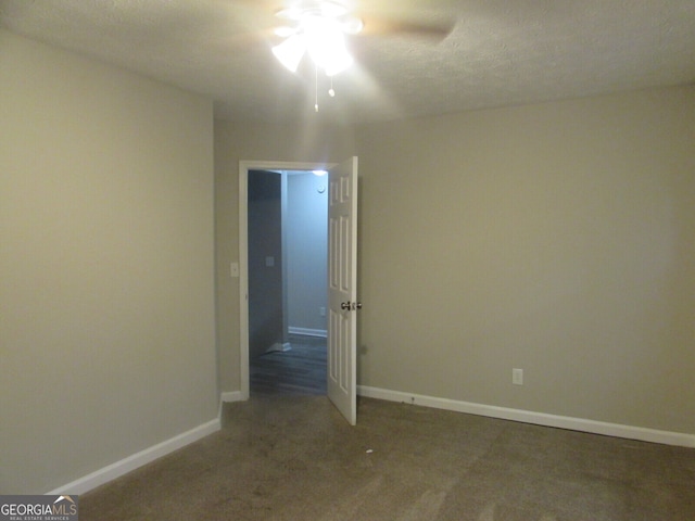 unfurnished room featuring ceiling fan, carpet flooring, and a textured ceiling