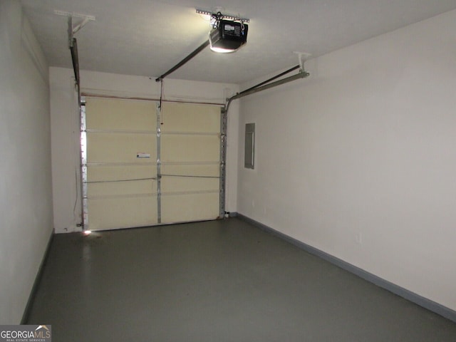 garage featuring a garage door opener and electric panel