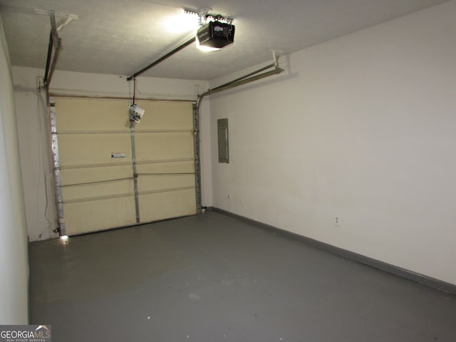 garage featuring a garage door opener and electric panel