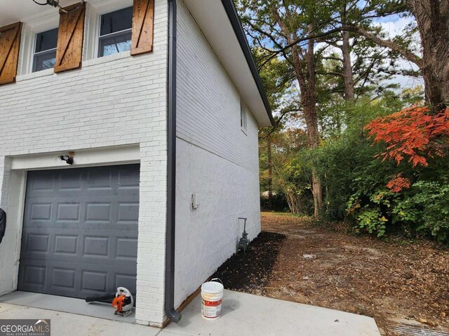 view of property exterior with a garage