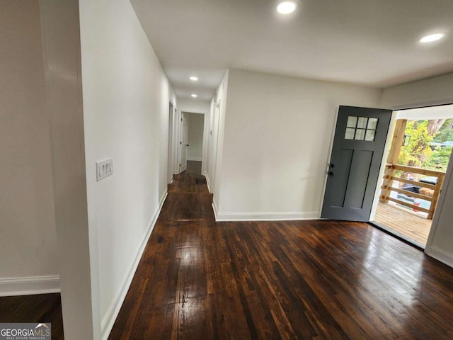 entryway with dark wood-type flooring