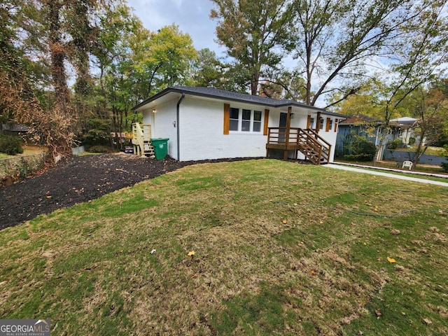 ranch-style house with a front lawn