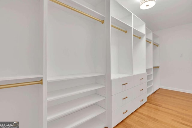 walk in closet featuring hardwood / wood-style floors