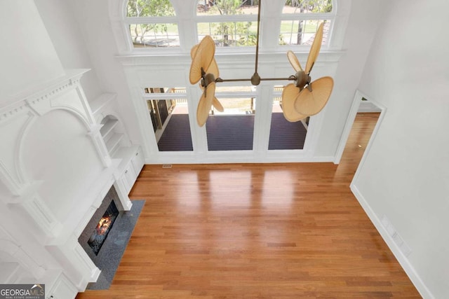 living room featuring wood-type flooring and ceiling fan