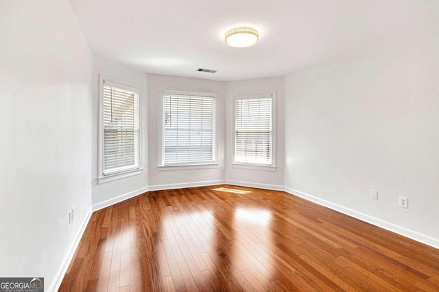 spare room featuring hardwood / wood-style floors