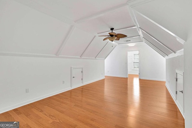 bonus room with lofted ceiling, light wood-type flooring, and ceiling fan