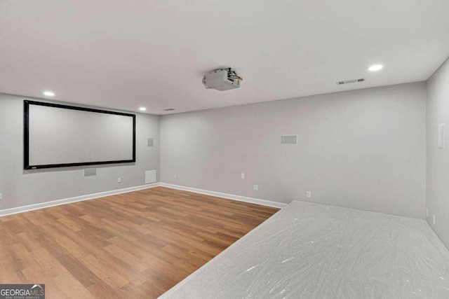 cinema room featuring hardwood / wood-style flooring