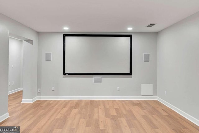 home theater with light hardwood / wood-style flooring