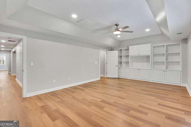 unfurnished living room featuring ceiling fan and light wood-type flooring