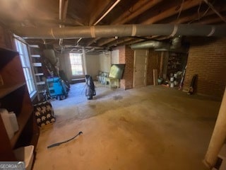 basement with brick wall