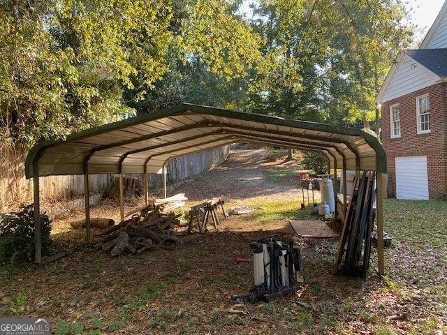 view of parking / parking lot with a carport