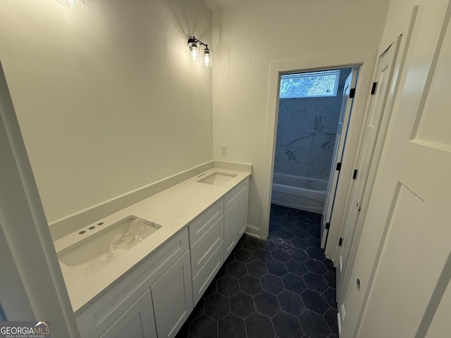 bathroom featuring tile patterned flooring and vanity