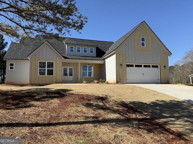 view of front of home with french doors and a garage