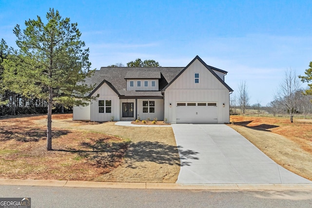 modern inspired farmhouse featuring a garage, driveway, board and batten siding, and roof with shingles