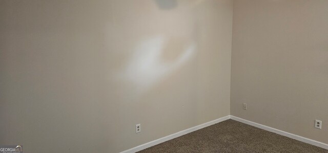 unfurnished room with carpet floors