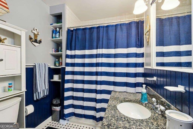 bathroom featuring vanity, tile patterned floors, a shower with curtain, and toilet