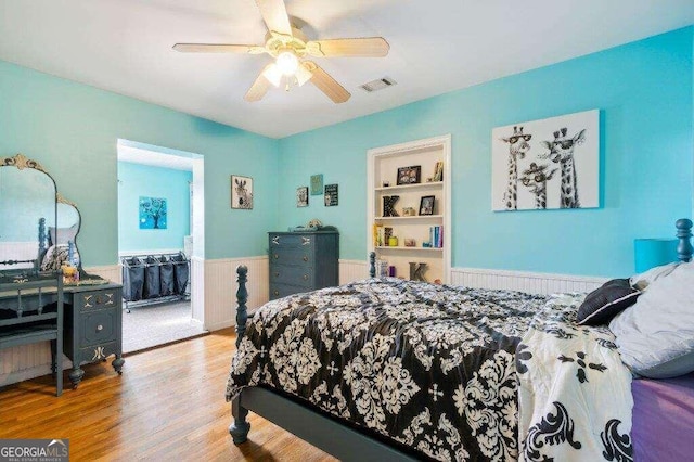 bedroom with ceiling fan and light hardwood / wood-style flooring