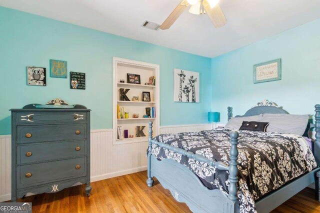 bedroom with ceiling fan and light hardwood / wood-style flooring