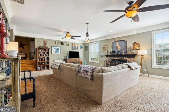 living room featuring carpet flooring, ornamental molding, and ceiling fan