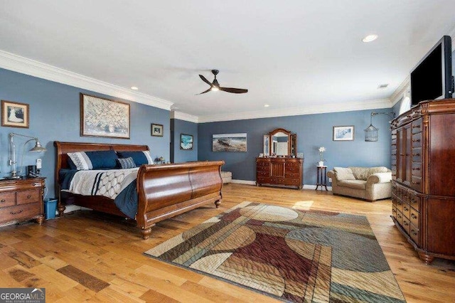 bedroom with light hardwood / wood-style floors, ornamental molding, and ceiling fan