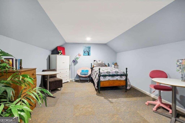 bedroom featuring carpet and lofted ceiling