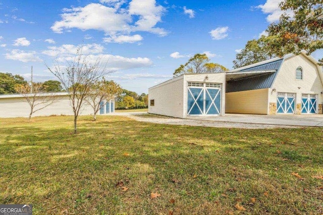 view of outdoor structure featuring a lawn