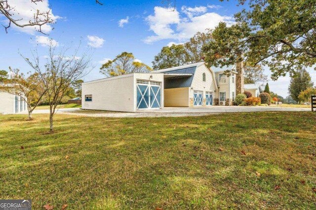 view of outbuilding with a lawn