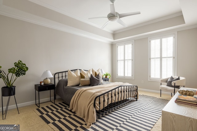 bedroom featuring ornamental molding, light colored carpet, and ceiling fan