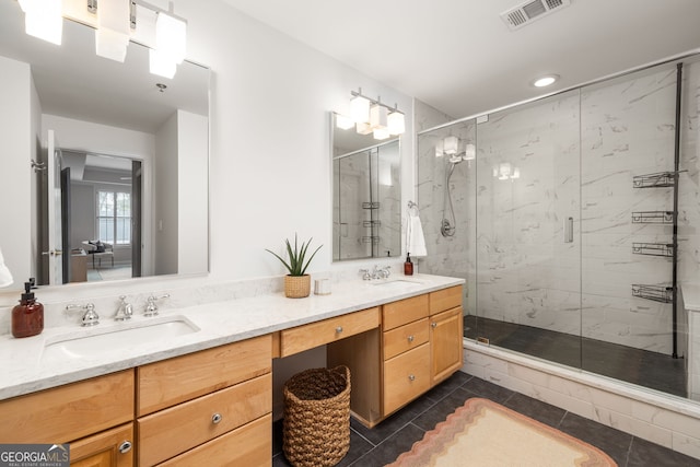 bathroom featuring vanity, an enclosed shower, and tile patterned floors