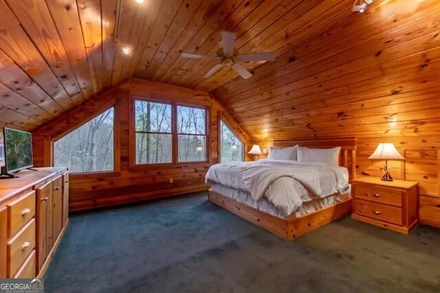 carpeted bedroom with lofted ceiling, ceiling fan, wood ceiling, and wood walls