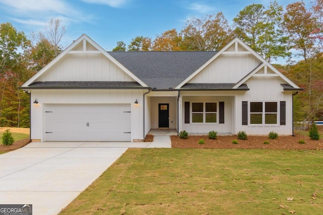 view of front of house with a front lawn and a garage