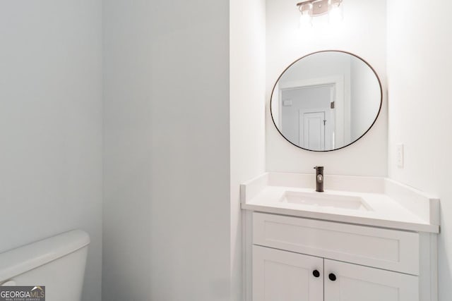 bathroom with vanity and toilet