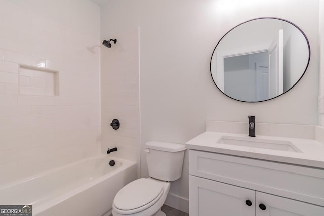 full bathroom with toilet, tiled shower / bath, and vanity