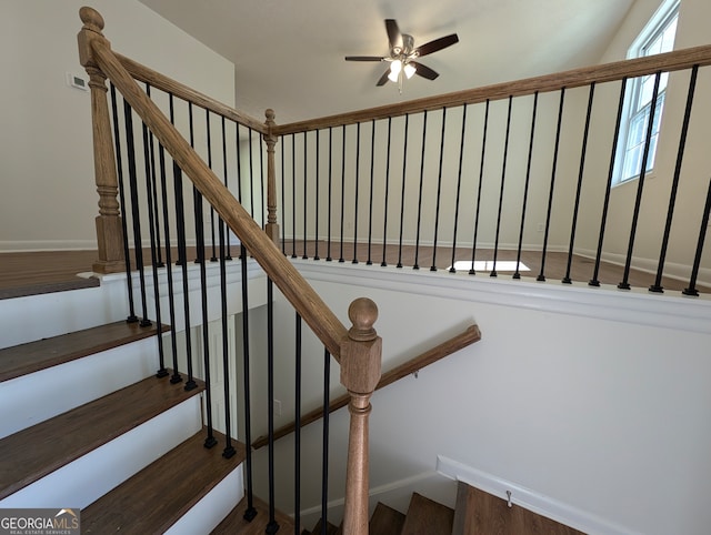 stairway with ceiling fan