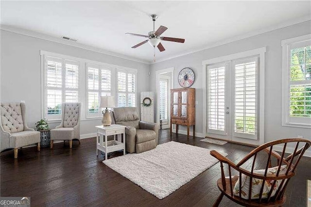 living area with french doors, ornamental molding, dark wood-type flooring, and ceiling fan