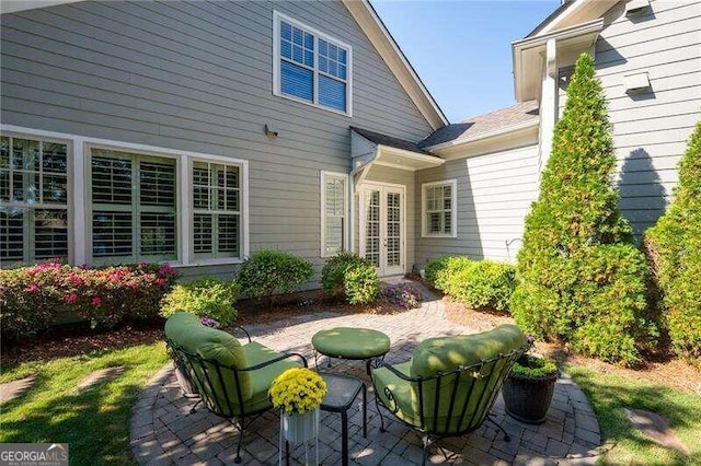 back of house with a patio