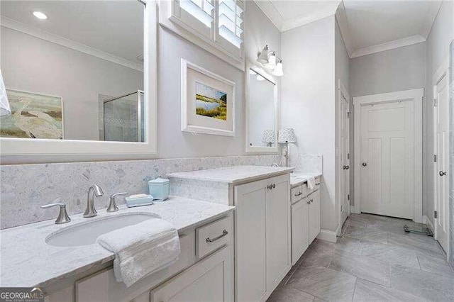 bathroom with vanity and ornamental molding