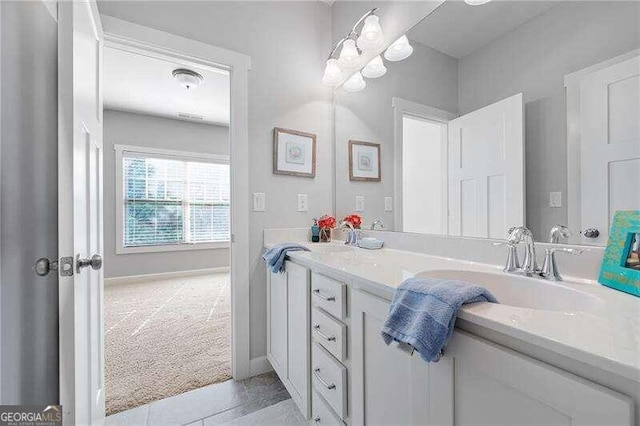 bathroom with vanity and tile patterned floors