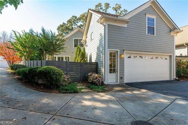 view of property exterior featuring a garage