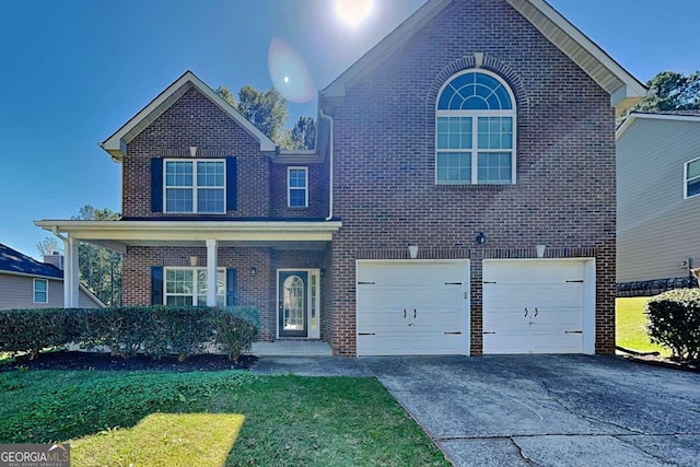 view of front property with a front yard and a garage