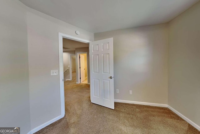 unfurnished room with carpet flooring