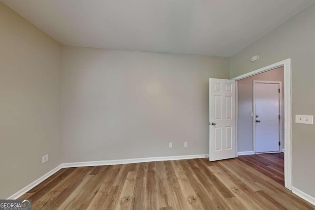 unfurnished room with light hardwood / wood-style flooring